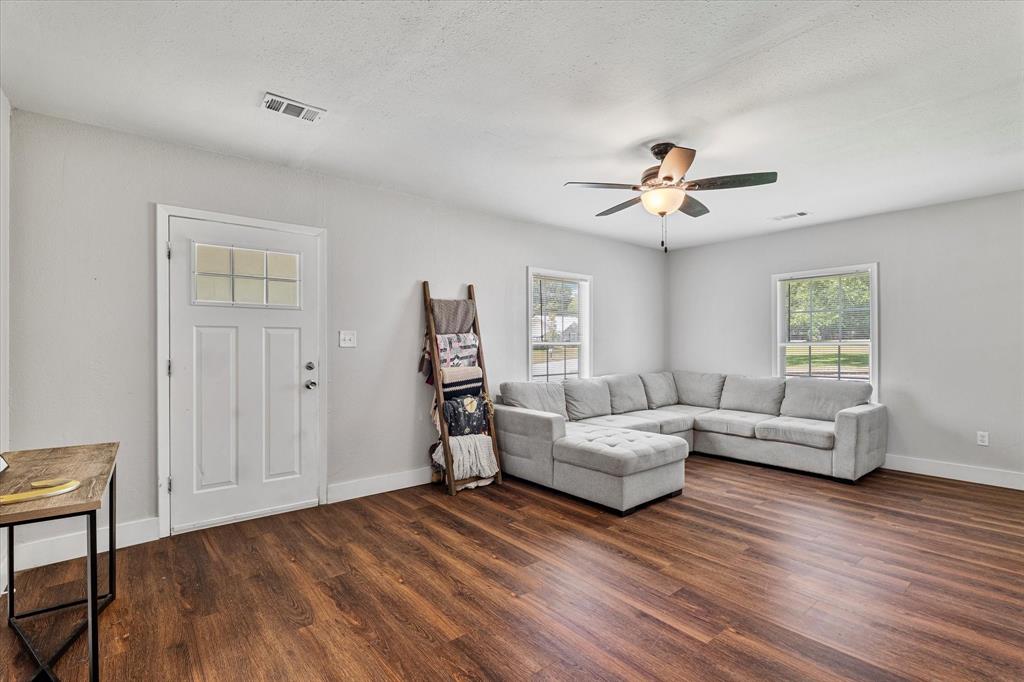 25 West Parnell Street Denison, TX 75020 - Photo 3 of 16 a living room with furniture and a window