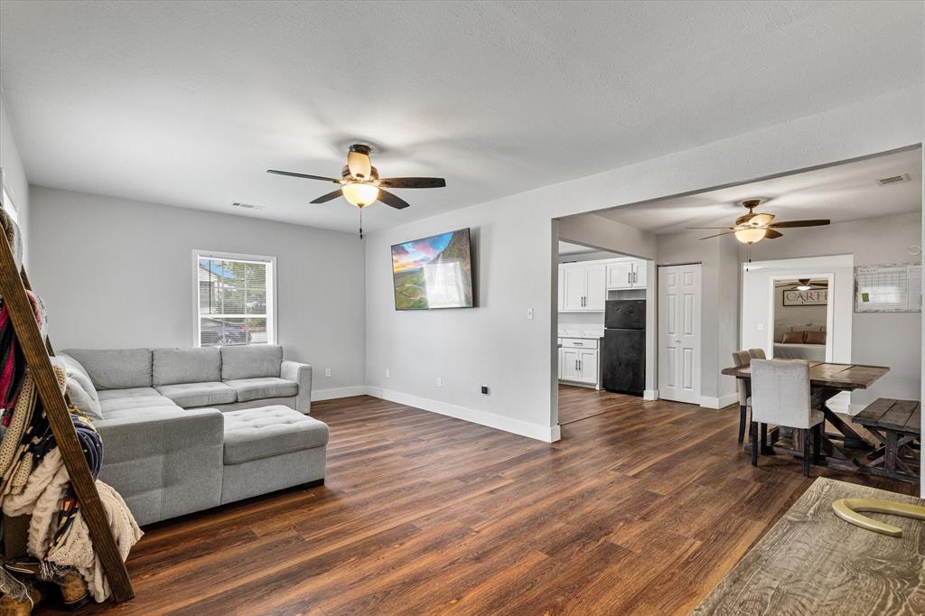 25 West Parnell Street Denison, TX 75020 - Photo 4 of 16 a living room with furniture and wooden floor