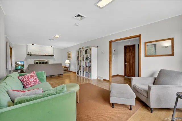 a living room with furniture and kitchen view