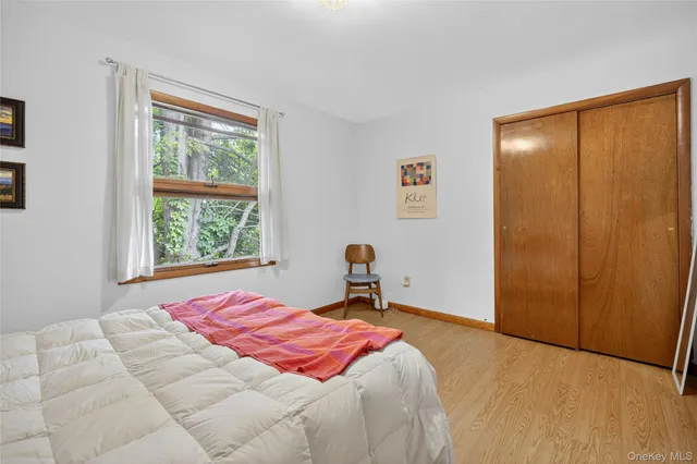 a spacious bedroom with a bed and a couch