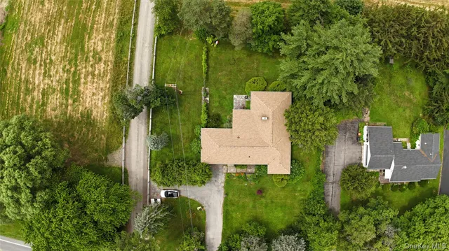 a picture of a room with a white wall and a large window