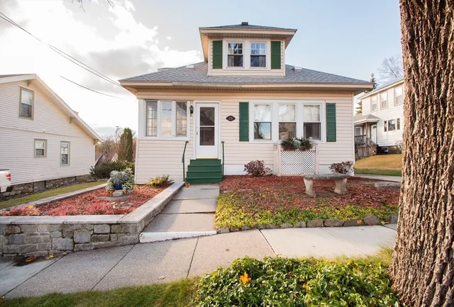 a front view of a house with garden