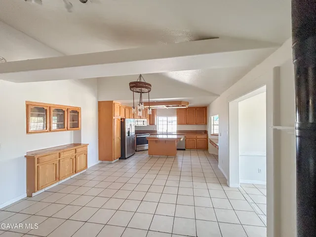 a view of a living room a chandelier fan and fire place