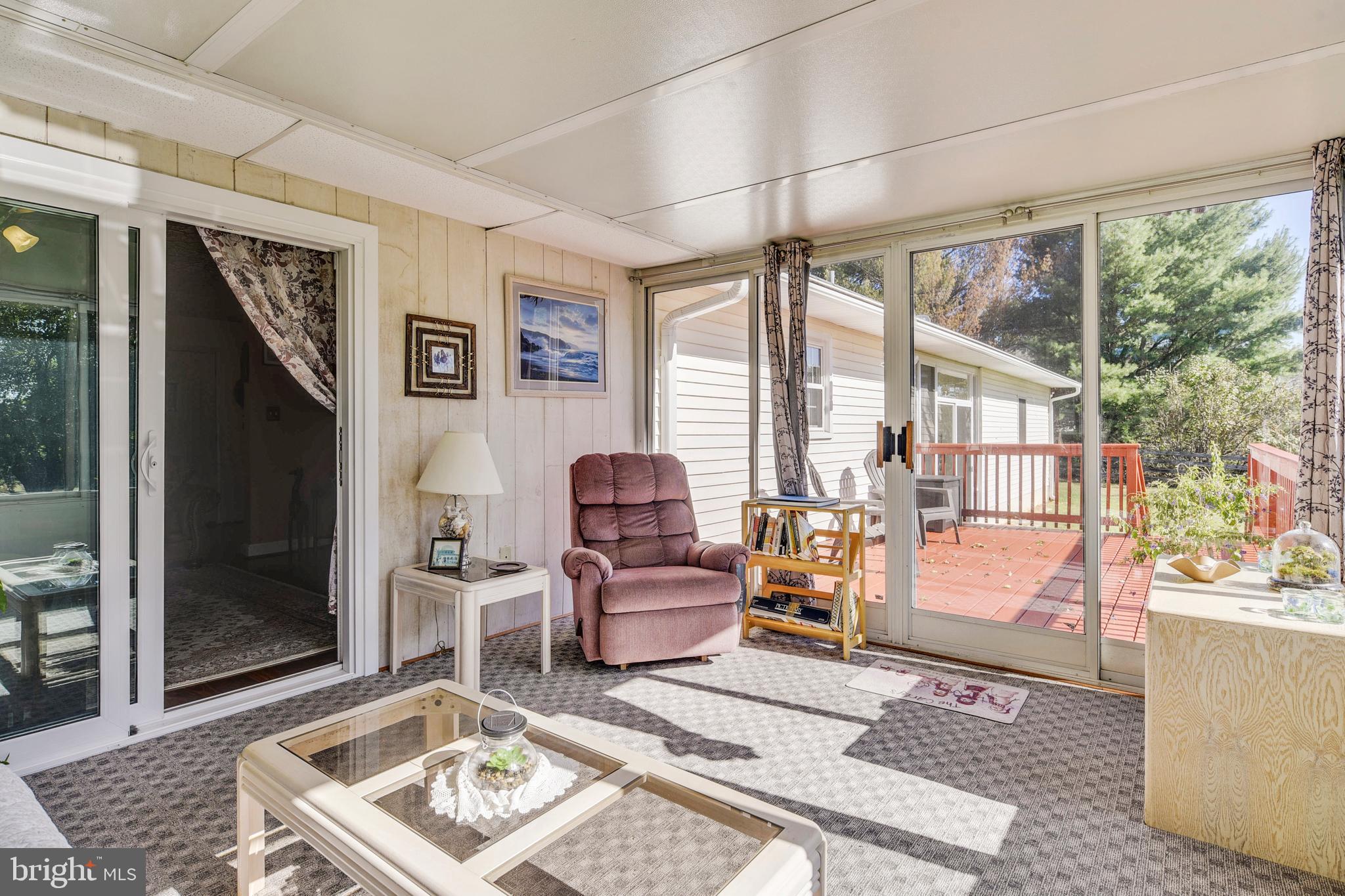 9583 Routts Hill Road Warrenton, VA 20186 - Photo 13 of 36 Sun Room View to Large Back Deck