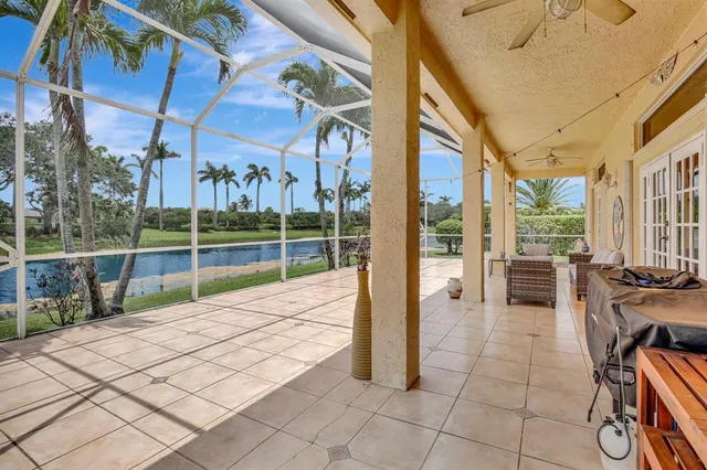 a view of a house with backyard porch and sitting area