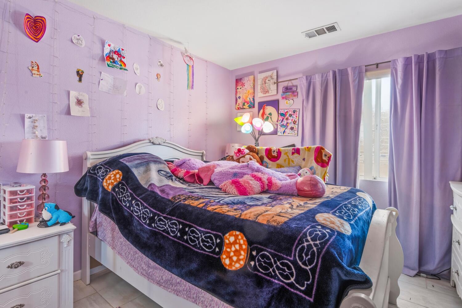13702 Inaja Street Desert Hot Springs, CA 92240 - Photo 12 of 19 a bedroom with a bed and a window
