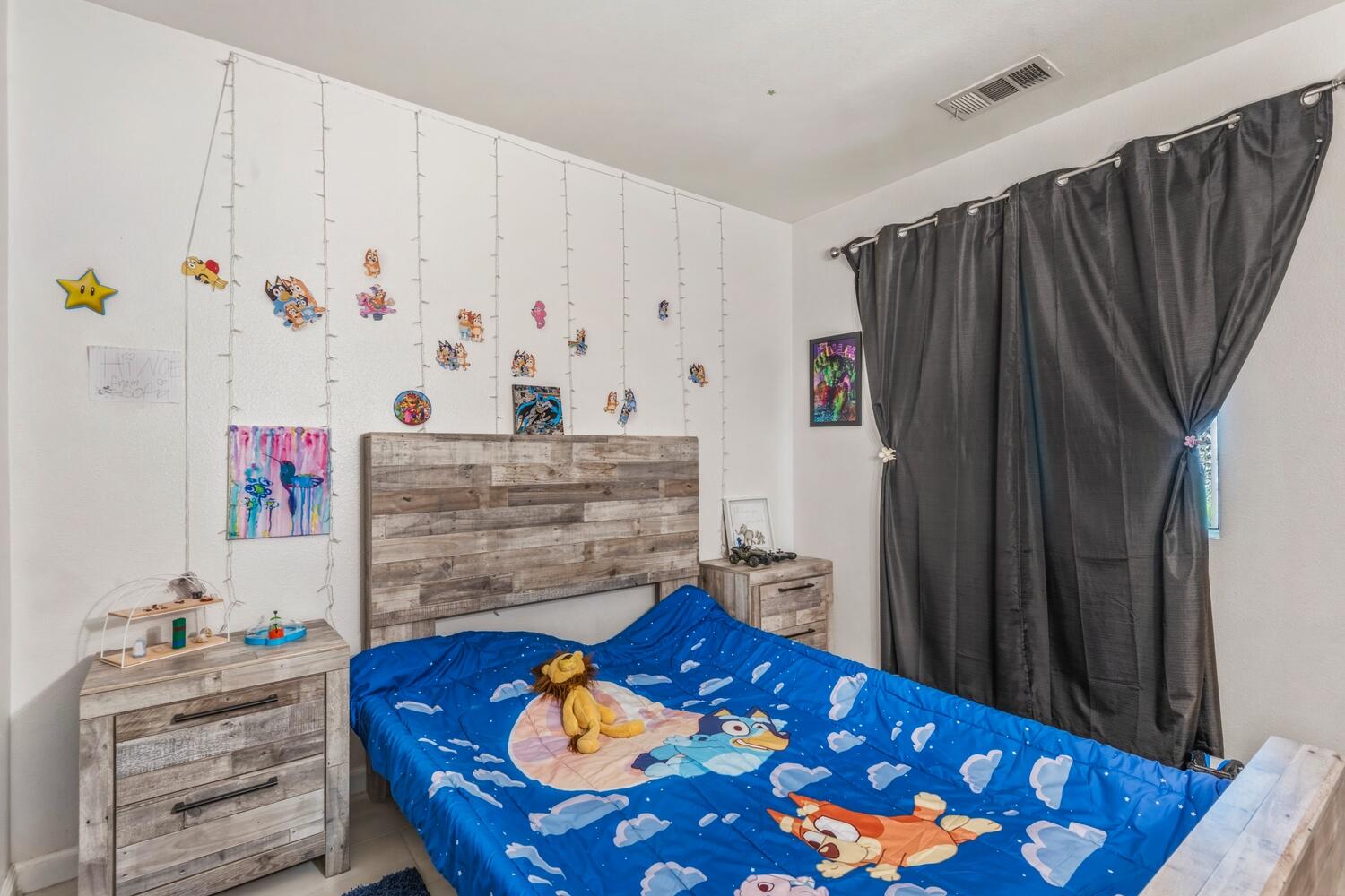 13702 Inaja Street Desert Hot Springs, CA 92240 - Photo 14 of 19 a bed room with a bed and a dresser