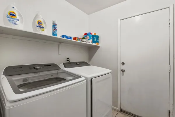 a utility room with dryer and washer