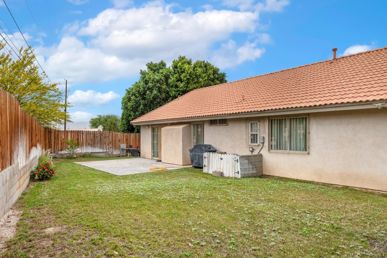 13702 Inaja Street Desert Hot Springs, CA 92240 - Photo 19 of 19 a view of a house with backyard and sitting area