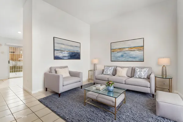a living room with furniture and a rug