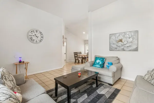 a living room with furniture and a table