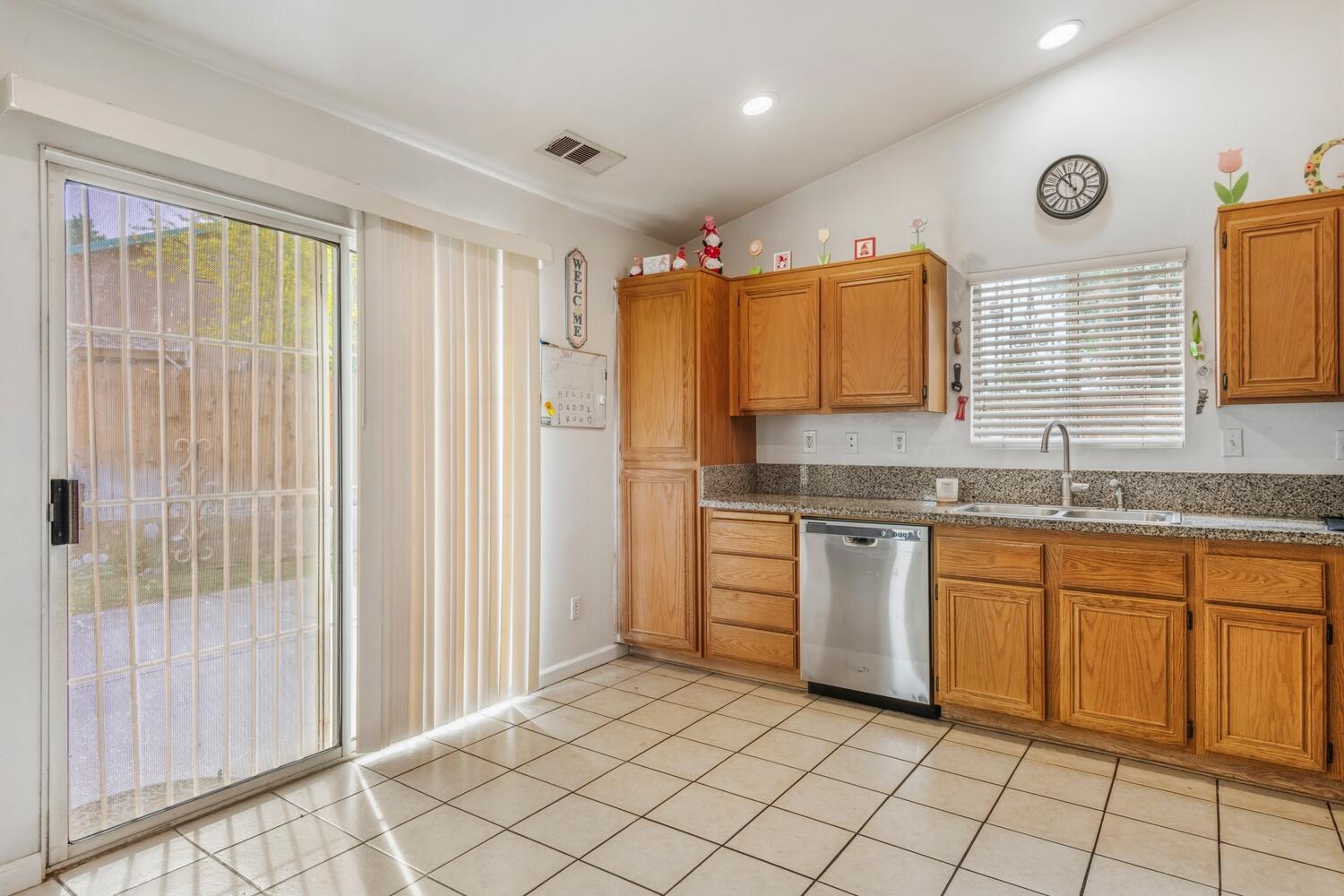 13702 Inaja Street Desert Hot Springs, CA 92240 - Photo 10 of 19 a kitchen with a sink cabinets and window