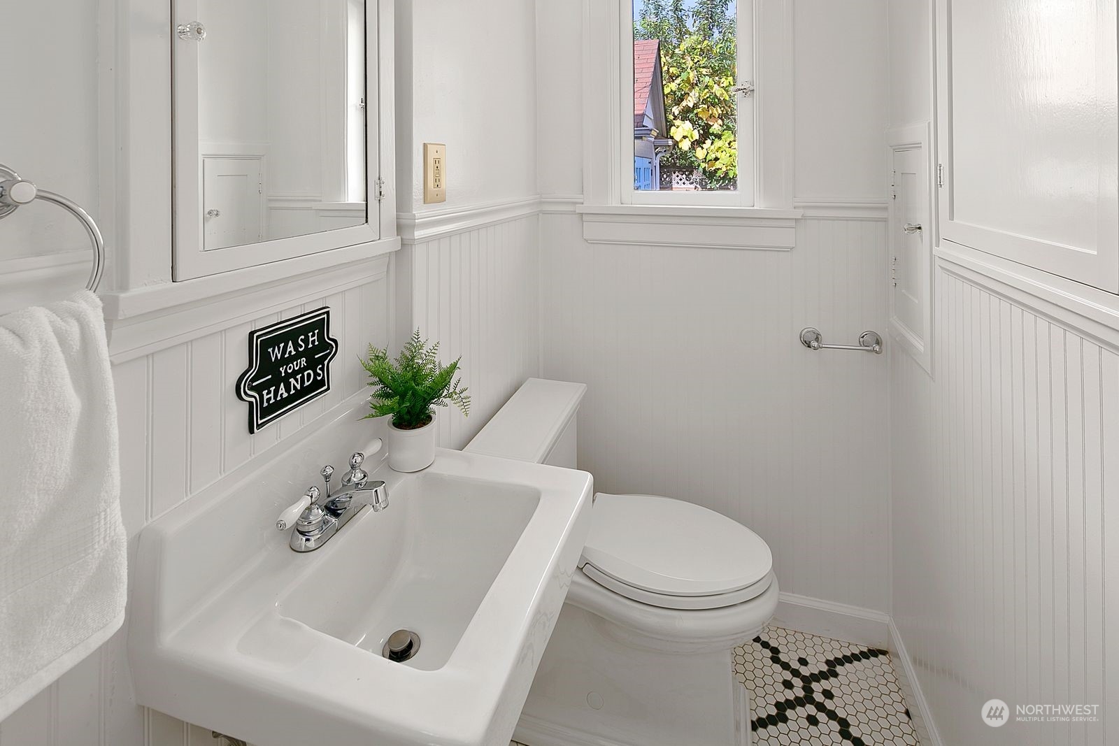 1908 Northeast Naomi Place Seattle, WA 98115 - Photo 12 of 30 a bathroom with a sink a toilet and a window