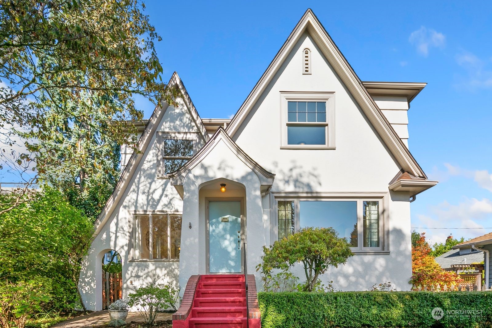1908 Northeast Naomi Place Seattle, WA 98115 - Photo 2 of 30 a view of a house with brick walls and potted plants