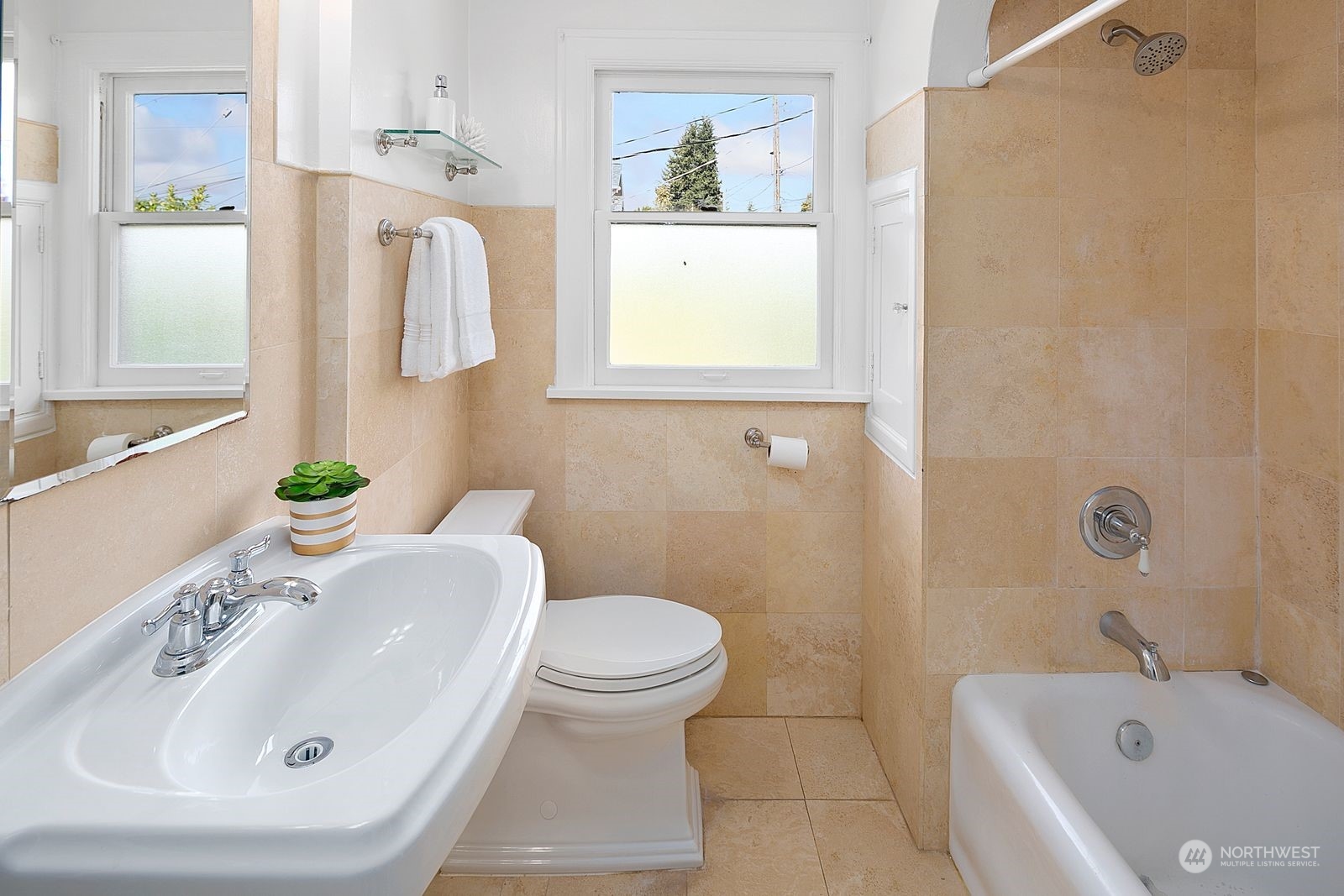 1908 Northeast Naomi Place Seattle, WA 98115 - Photo 21 of 30 a bathroom with a sink a toilet and shower