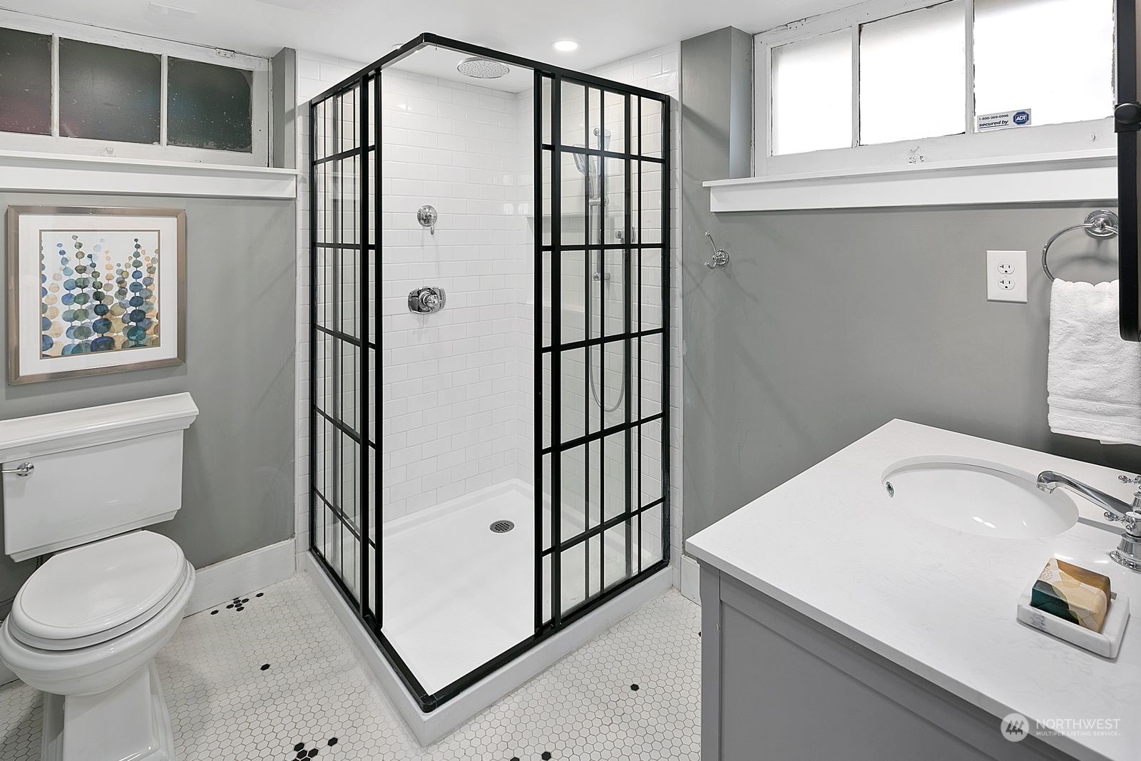 1908 Northeast Naomi Place Seattle, WA 98115 - Photo 28 of 30 a bathroom with a sink a toilet and a window