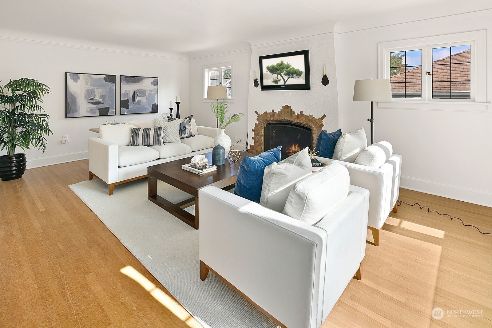 1908 Northeast Naomi Place Seattle, WA 98115 - Photo 4 of 30 a living room with furniture and a painting on the wall