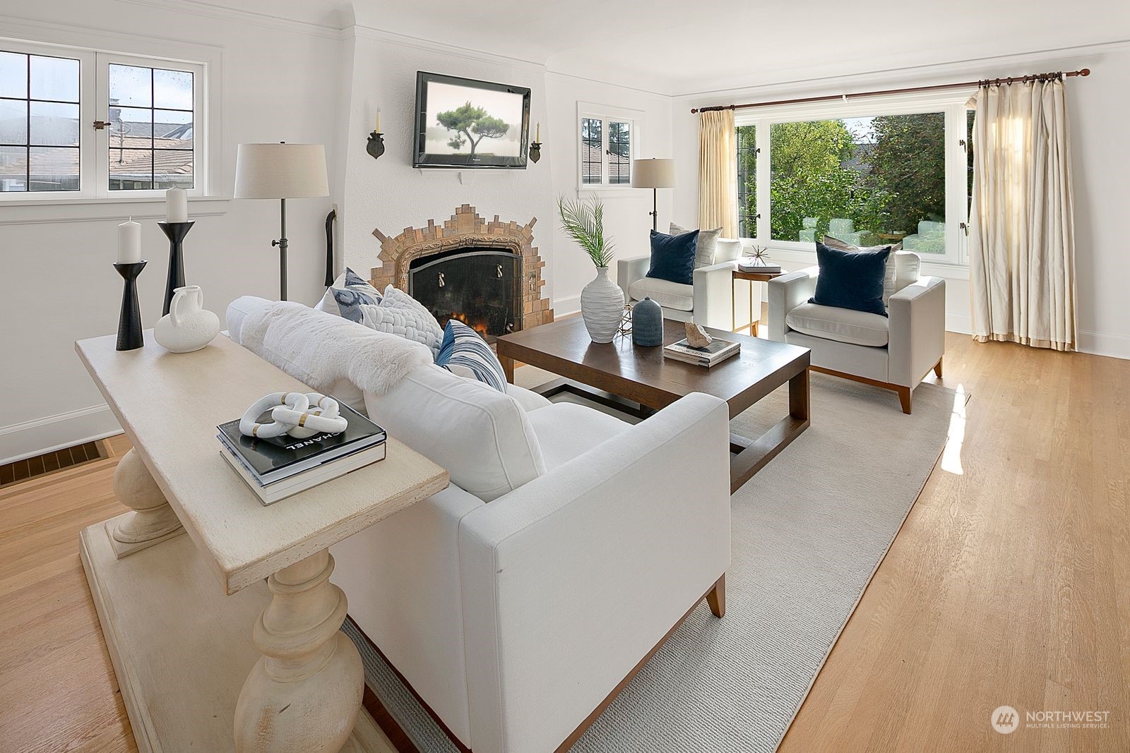 1908 Northeast Naomi Place Seattle, WA 98115 - Photo 5 of 30 a living room with furniture and a fireplace