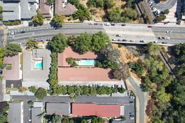 an aerial view of residential houses and outdoor space