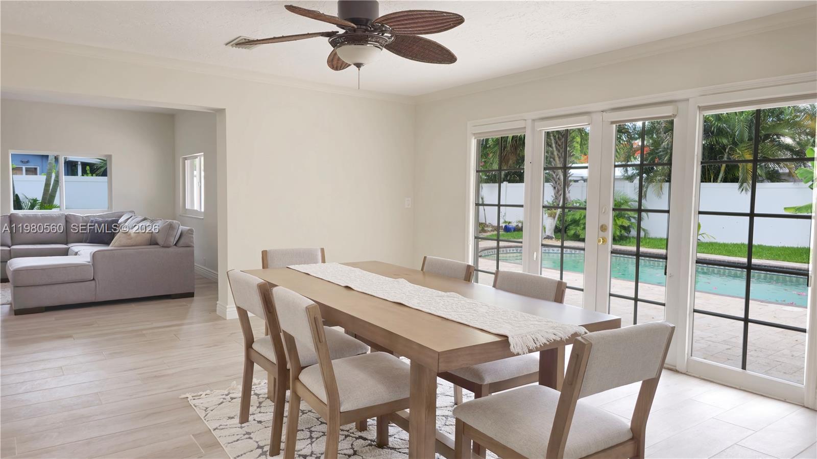 909 Southwest 9th Avenue Boca Raton, FL 33486 - Photo 15 of 18 a dining room with furniture window and wooden floor