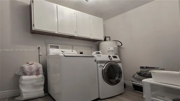 a utility room with dryer and washer