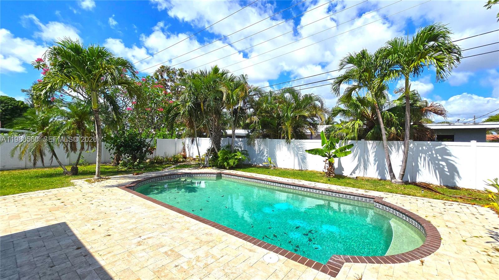 909 Southwest 9th Avenue Boca Raton, FL 33486 - Photo 3 of 18 a view of swimming pool with a yard