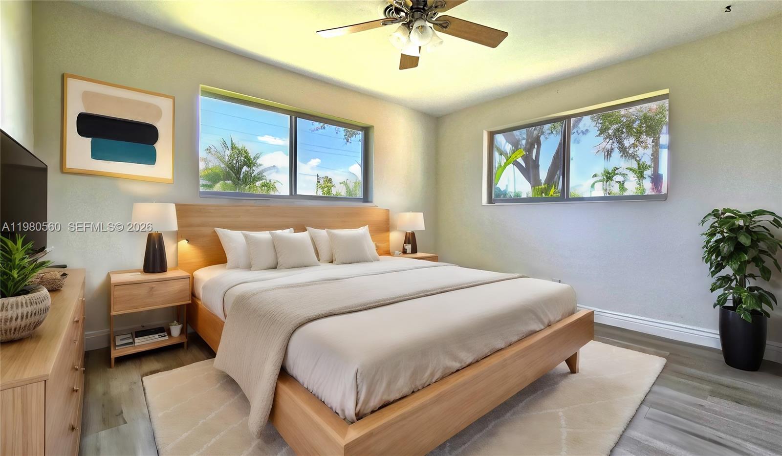 909 Southwest 9th Avenue Boca Raton, FL 33486 - Photo 5 of 18 a bedroom with bed and a painting on the wall