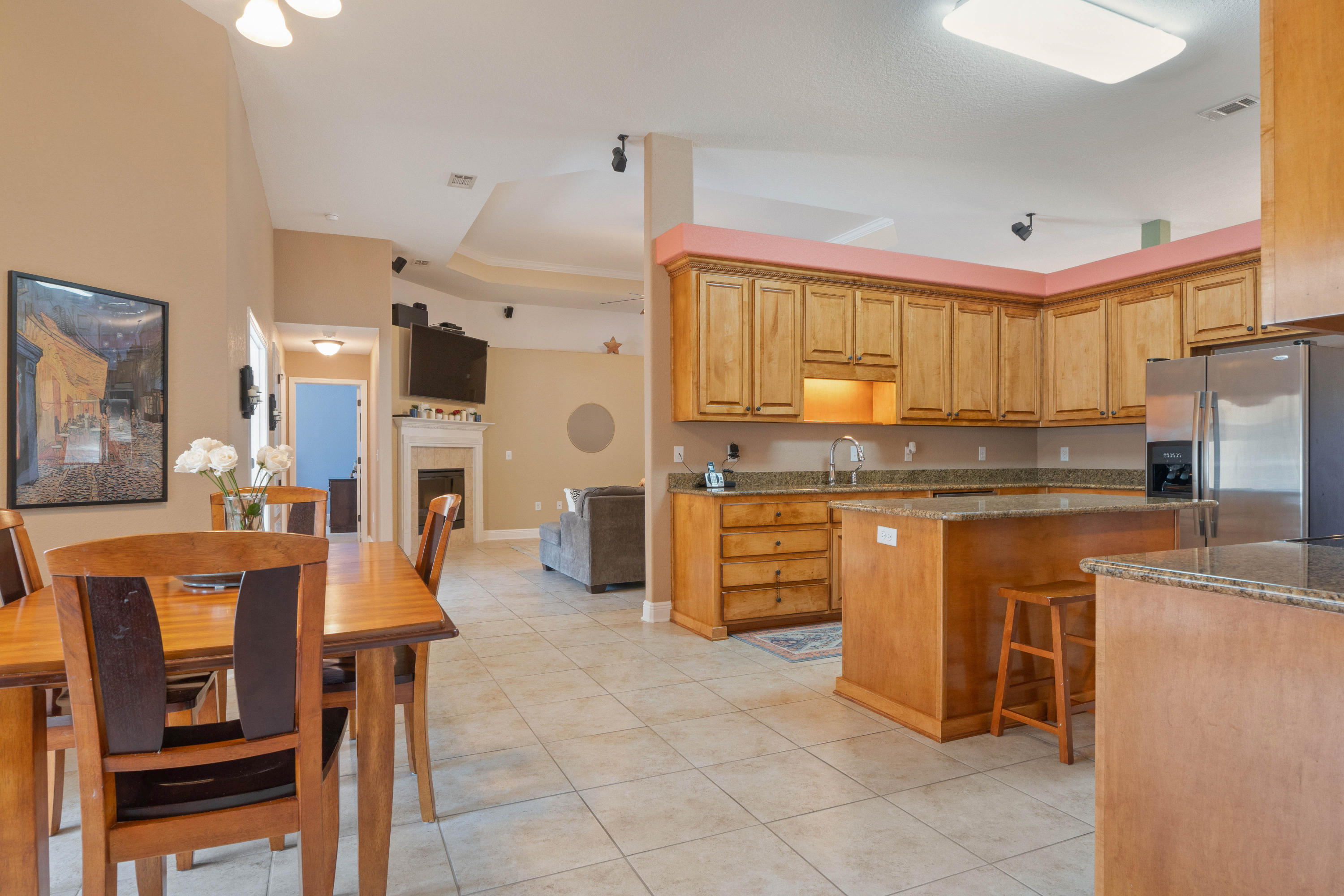 9935 Nichols Lake Road Milton, FL 32583 - Photo 4 of 40 a kitchen with granite countertop a stove a sink a dining table and chairs