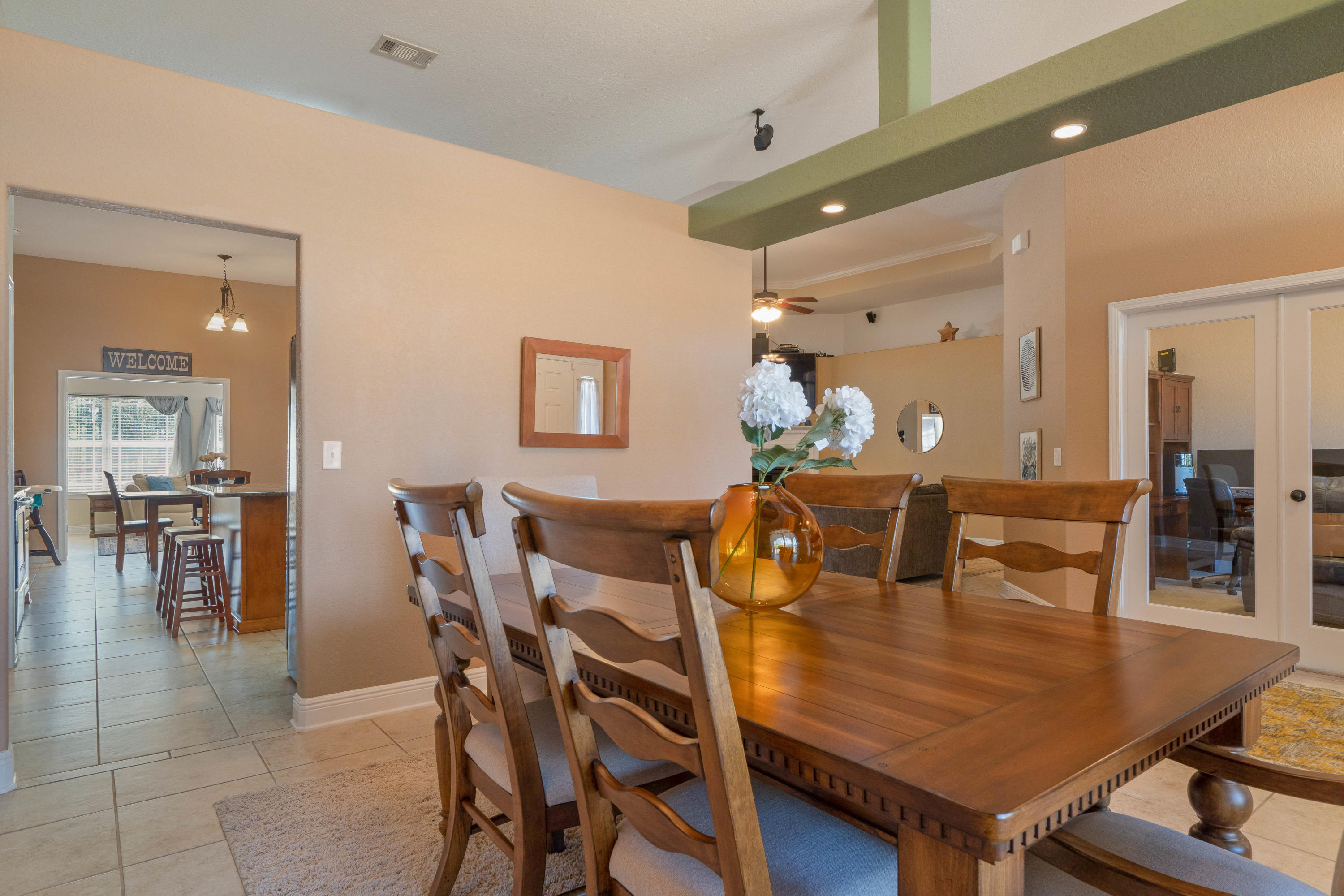 9935 Nichols Lake Road Milton, FL 32583 - Photo 7 of 40 a dining room with furniture and wooden floor