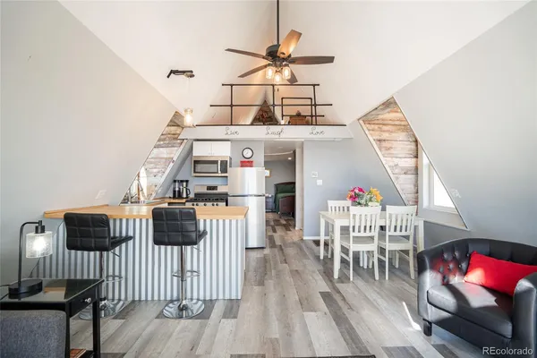 a kitchen with a sink appliances and cabinets
