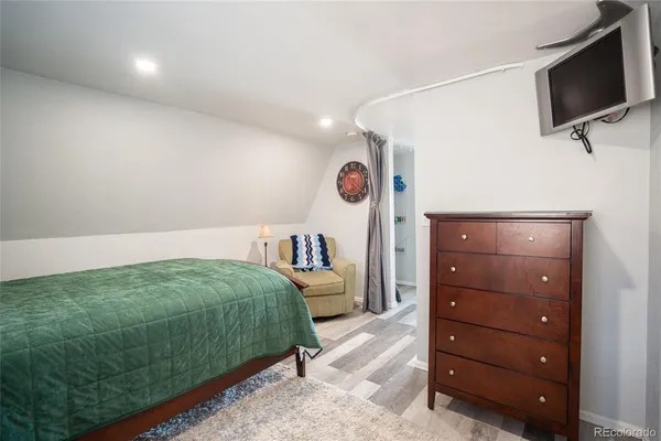 a view of a porch with furniture and front door