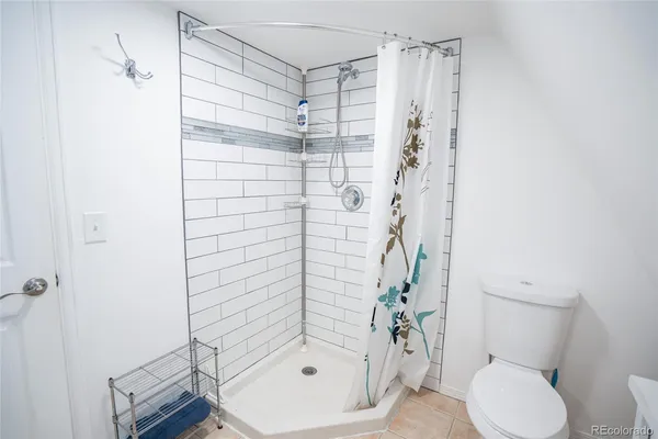 a bedroom with furniture and wooden floor