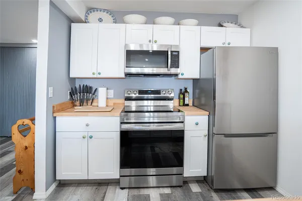 a bathroom with a shower toilet and sink