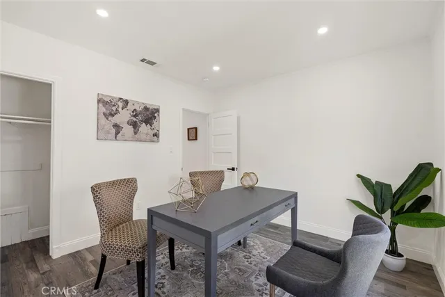 a workspace with furniture and wooden floor