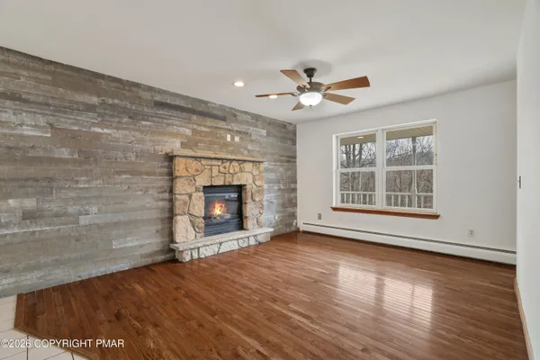 an empty room with wooden floor