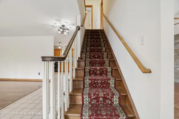 wooden floor with staircase