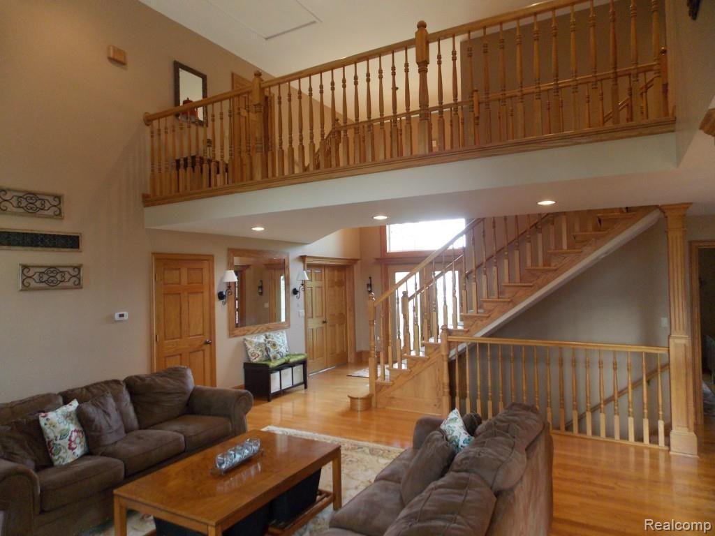 2974 Hannan Road Imlay City, MI 48444 - Photo 15 of 45 There is a catwalk through the great room that access one of the 4 bedrooms on the 2nd floor. This home has 6 panel oak doors throughout the main living areas.