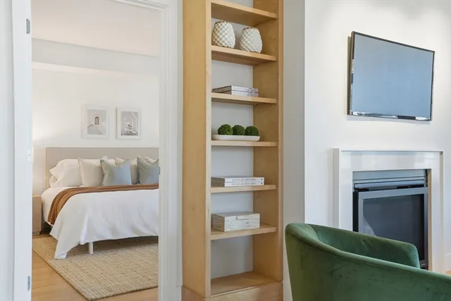 a bedroom with a bed and walk in closet