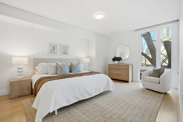 a bedroom with bed and a couch