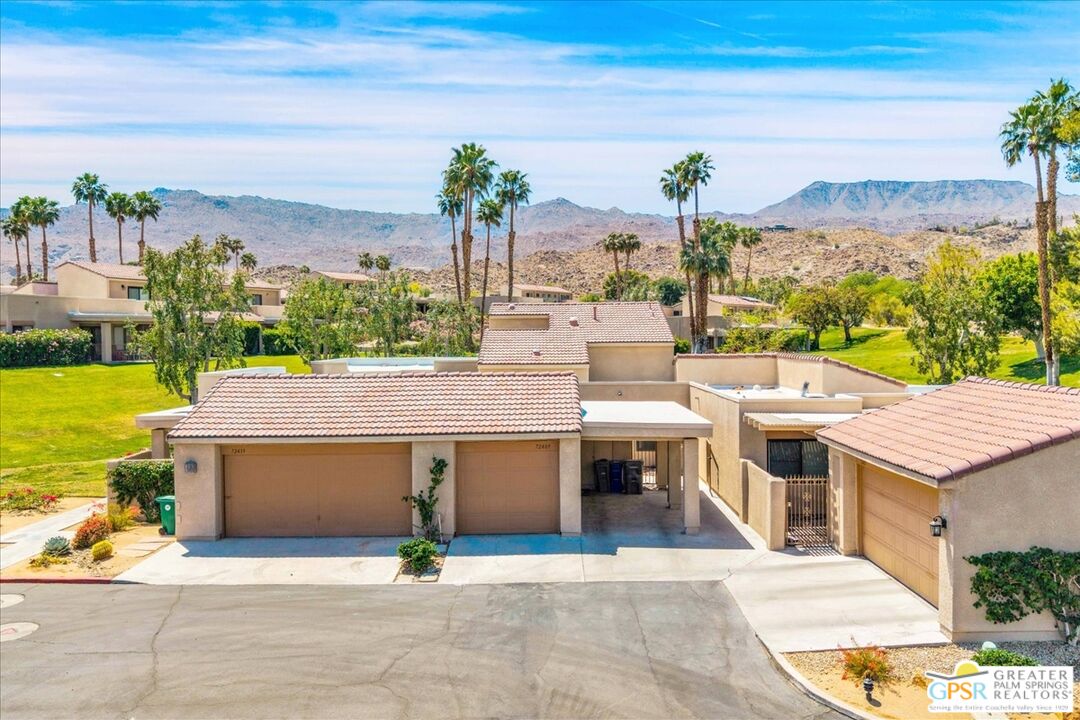 Restricted Address Palm Desert, CA 92260 - Photo 1 of 2 a view of a swimming pool with an outdoor seating and a garden