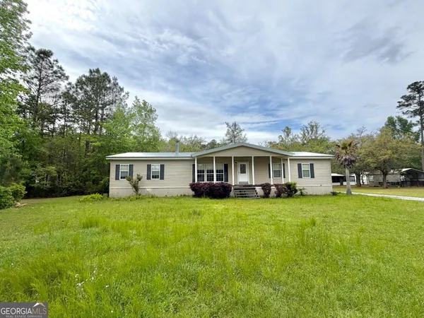 a view of a house with a big yard