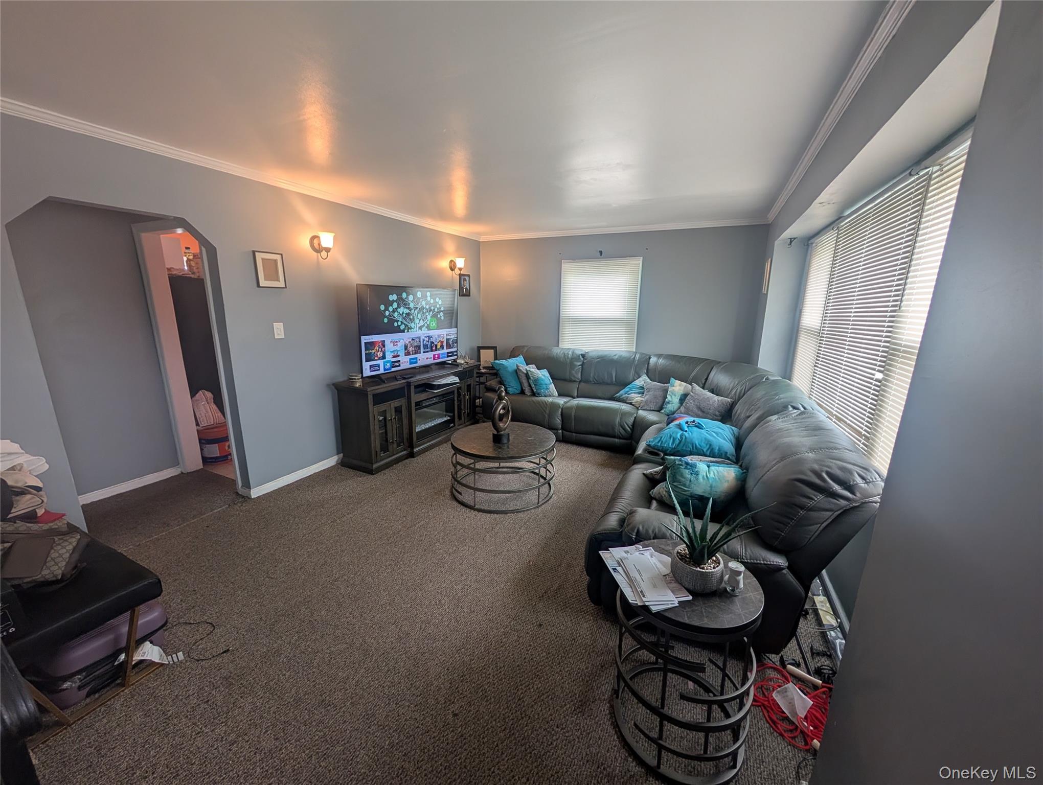 39 State Street Valley Stream, NY 11580 - Photo 3 of 7 a living room with furniture and a chandelier