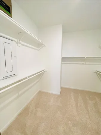 a view of an empty walk in closet