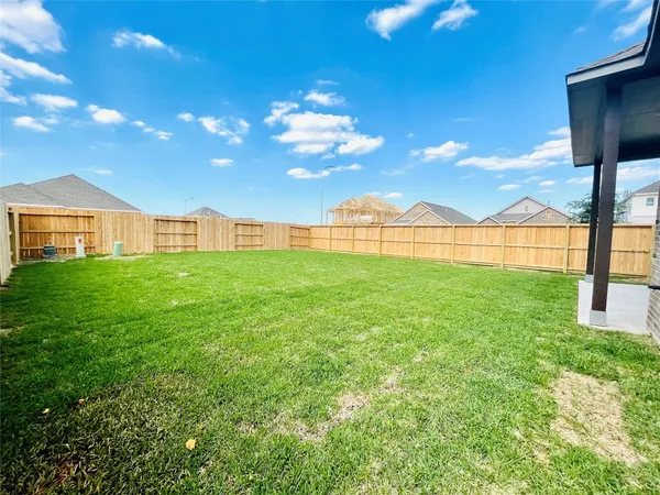 a view of a big yard with a palm tree