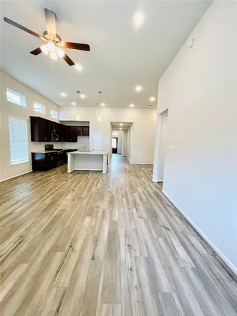 a view of a kitchen with a sink and a stove top oven