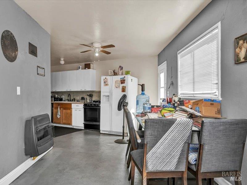 315 White Cottage Road North Angwin, CA 94508 - Photo 23 of 36 a view of a dining room with furniture and a window