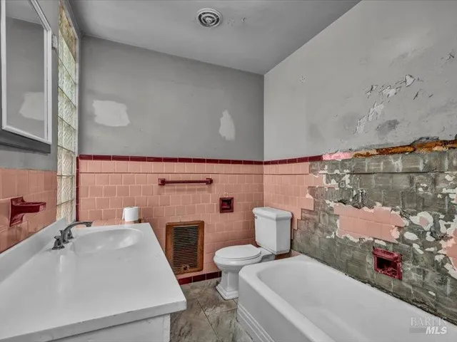 a bathroom with a sink and toilet