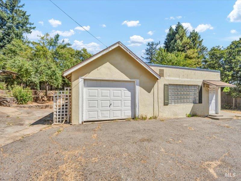 315 White Cottage Road North Angwin, CA 94508 - Photo 30 of 36 a view of a house with a yard and garage