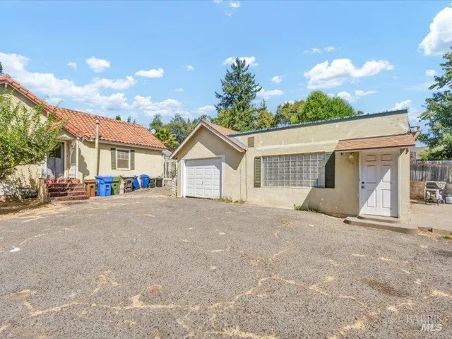 a view of a house with a outdoor space and street view