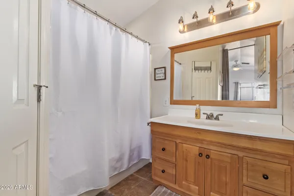 a bathroom with a double vanity sink and mirror